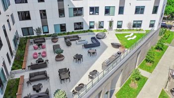 an aerial view of the courtyard of an office building with chairs and tables at Inspire West Town, CHICAGO